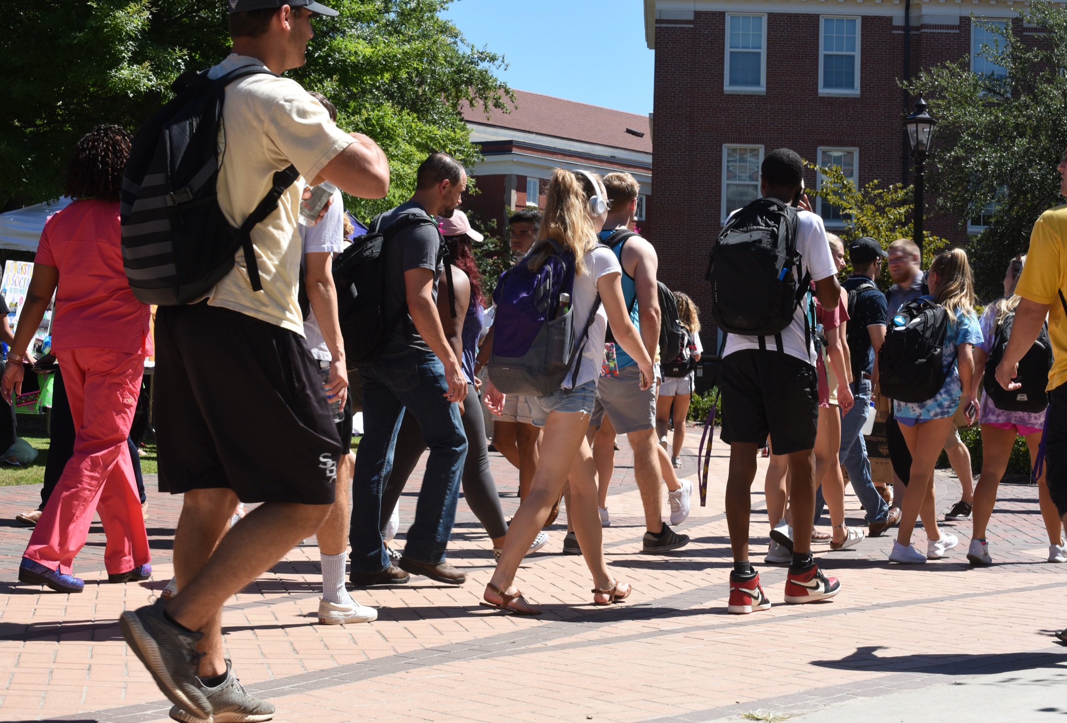Students crossing a courtyard at the University of Florida